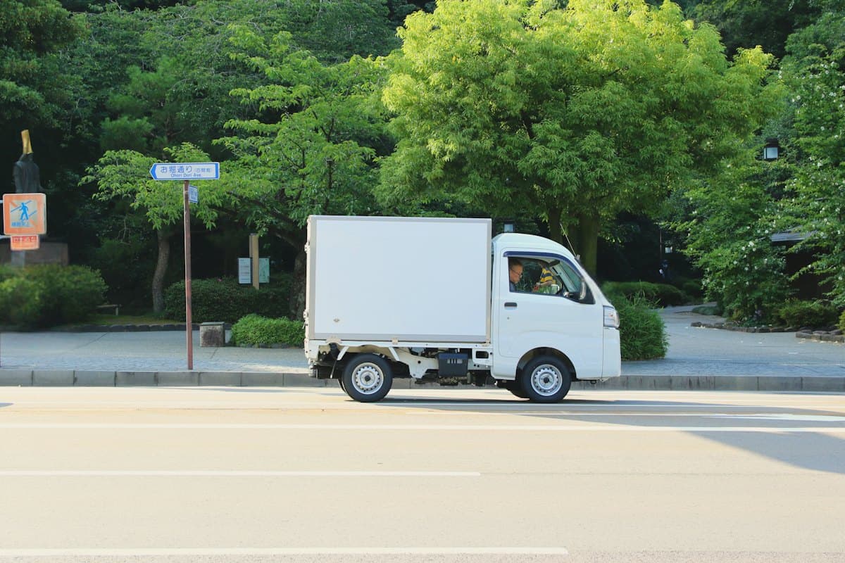 Small white box lorry on a suburban street